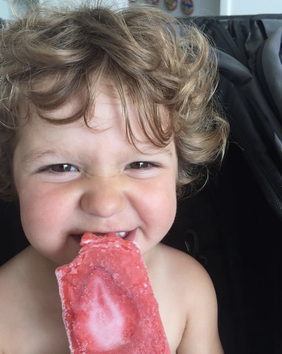 Kid eating Paletas Morelia - Strawberry Flavor Popsicle